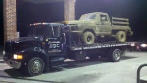 towing a lifted mud truck on our rollback